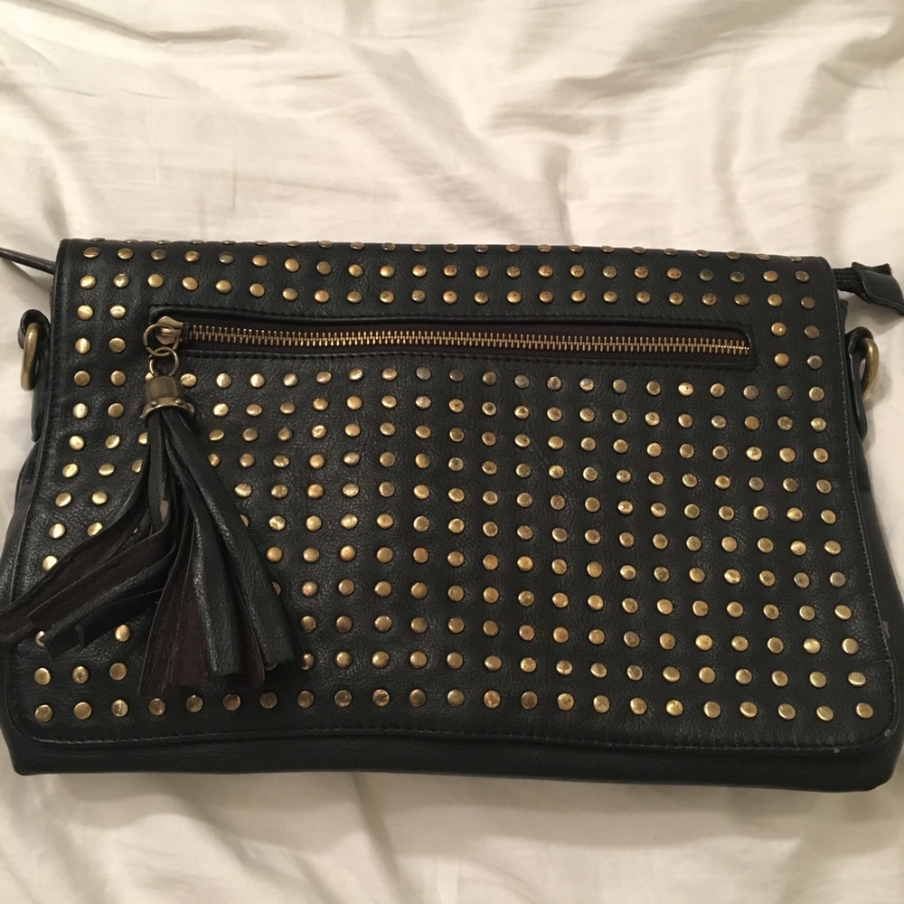 Black gold studded clutch with tassel zip